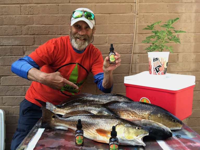 Danny Cosmo, stunt man, fisherman, rocky river hemp regular picture with fish and hemp oil